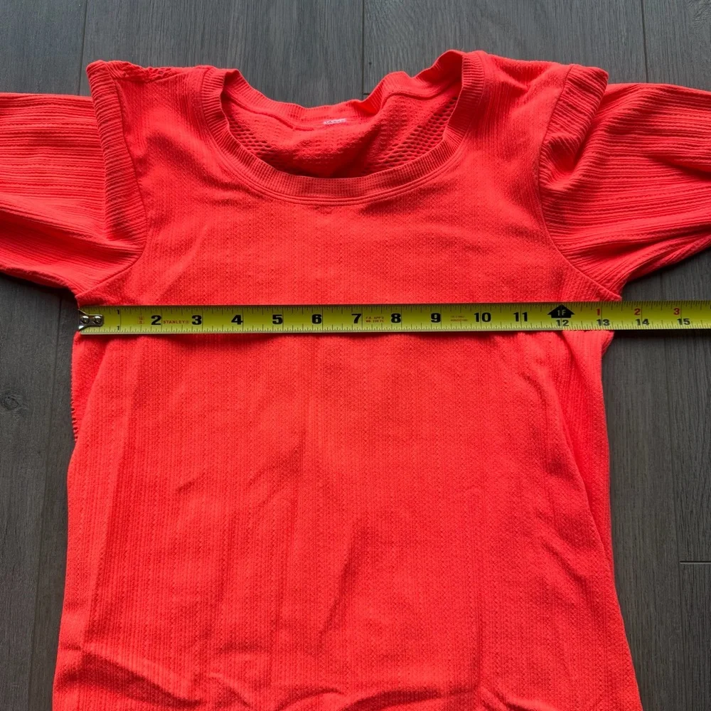 EUC Alo Yoga Exhale long sleeve top in neon orange/light pink
